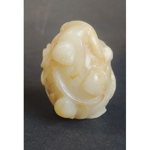 rare yellow jade snuff bottle carved from a monkey and peach of longevity China 18th century